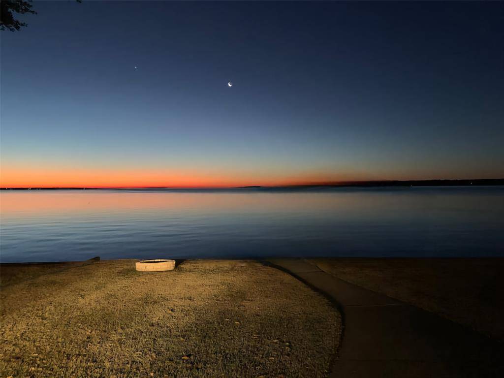 See the stars from your back yard sparkling over the lake.  *Digitally altered to show what it would look like without the boathouse.