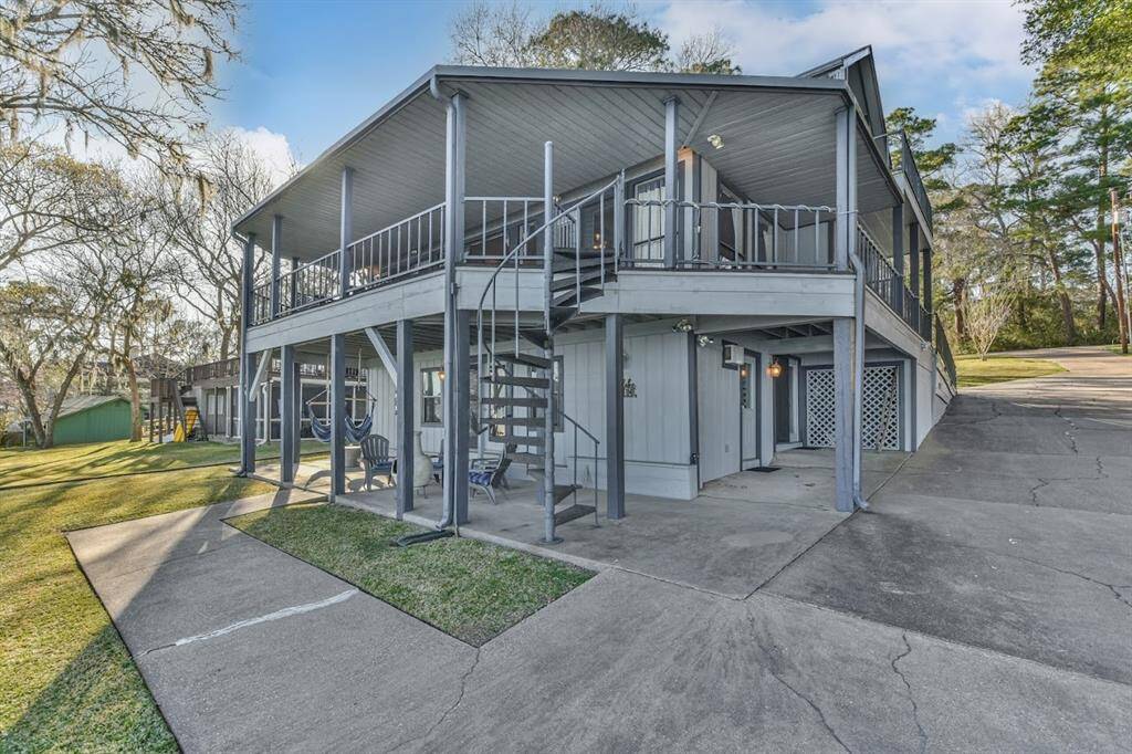 Sprawling spaces with spiral stair case between levels. Lake life at its finest.