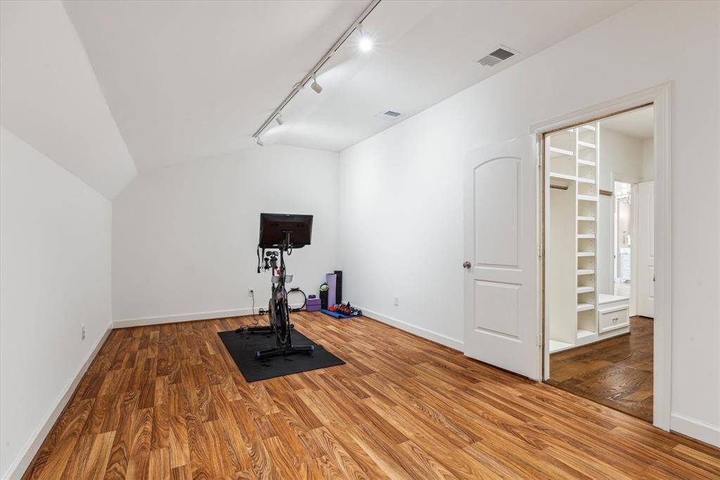 Bonus room off of primary suite perfect for home gym.
