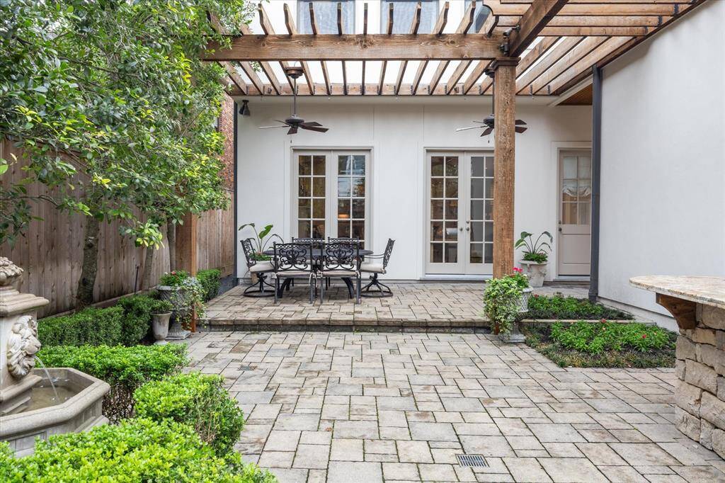 Beautifully paved and landscaped backyard with summer kitchen.  Yard has plenty of room for a pool or grass/turfing, if preferred.  Pavers are just set in sand.