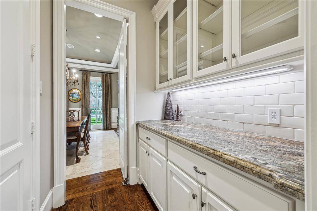 Convenient butler's pantry with large, walk-in food pantry.