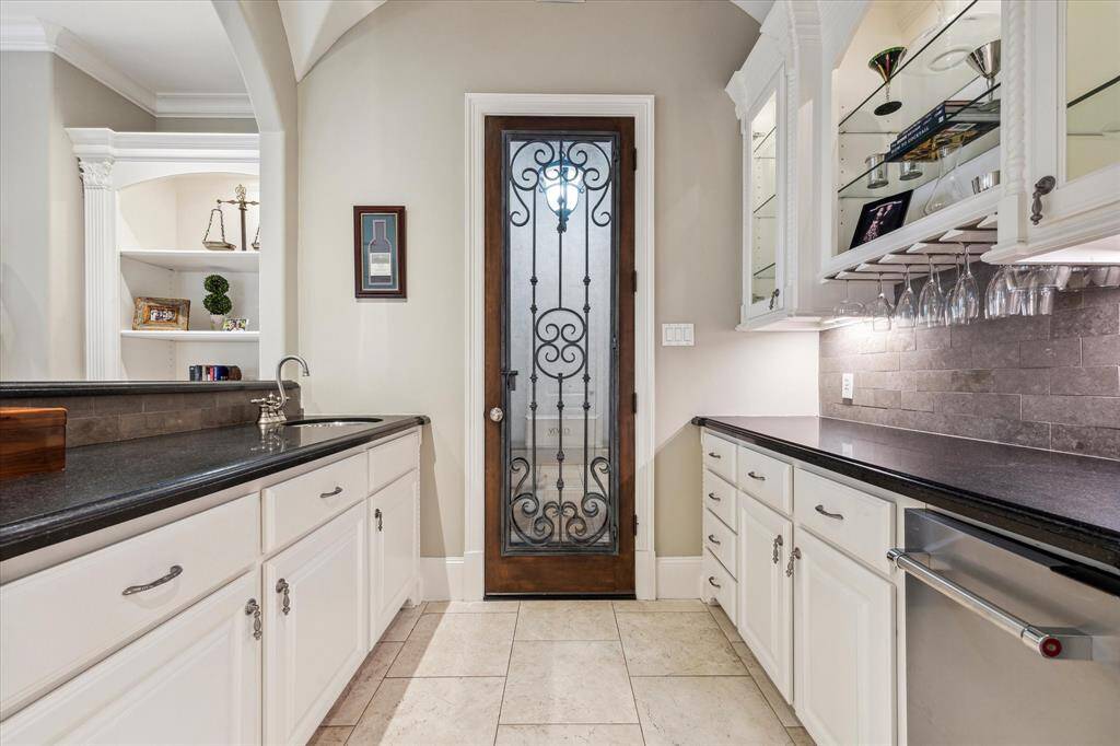 Wet bar with 350-bottle (approximately) climatized wine storage.  Wrought-iron on door is removable, if preferred.