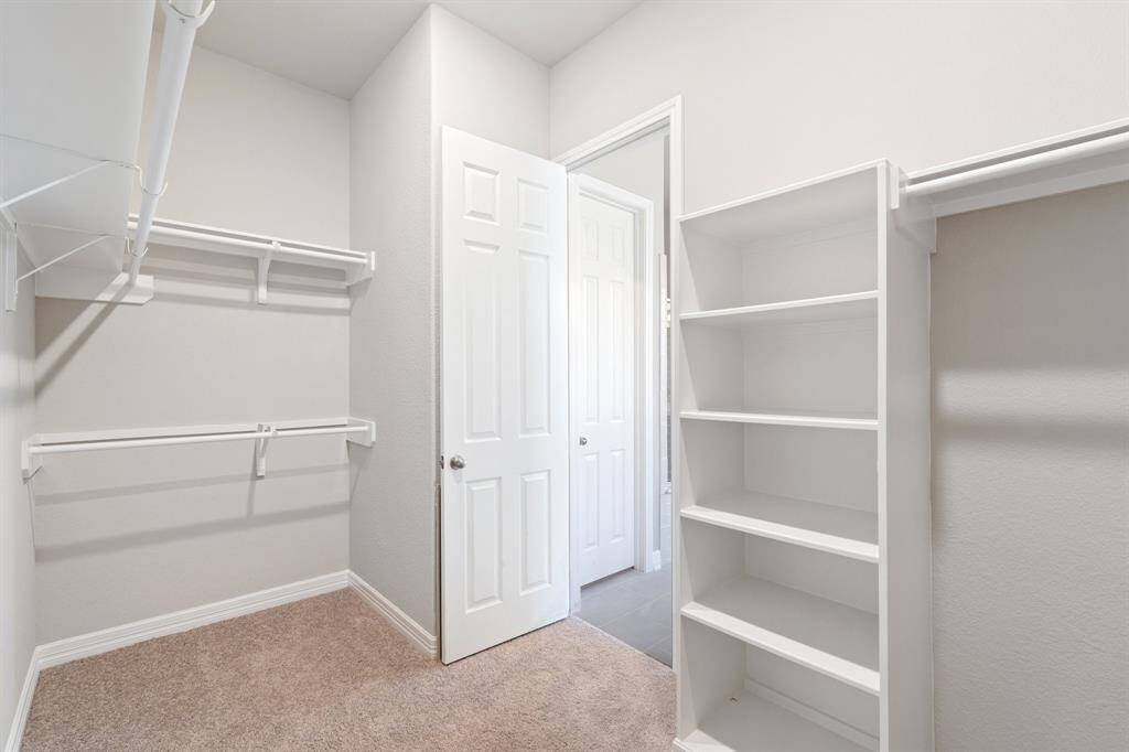 A view of your large primary walk-in Closet