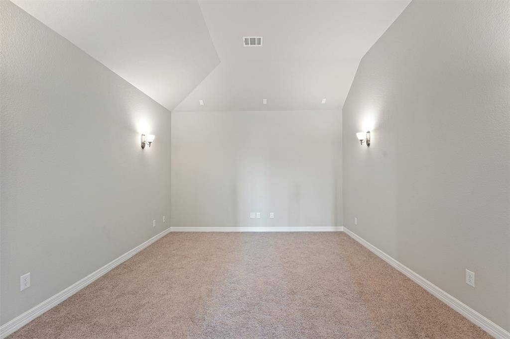 Whether it's family movie night, cheering on your favorite sports team, or hosting a gaming marathon, this media room caters to every form of entertainment.