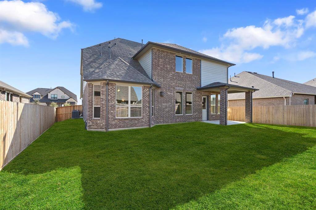 This backyard is perfect for family gatherings, social events, or simply unwinding in the fresh air.