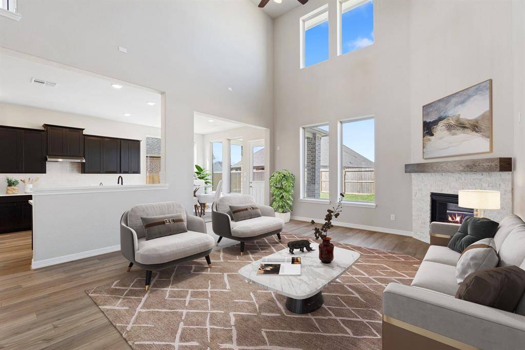 This home boasts a spacious open concept layout that combines the best of modern design and comfort for everyday living. Photo is virtually staged