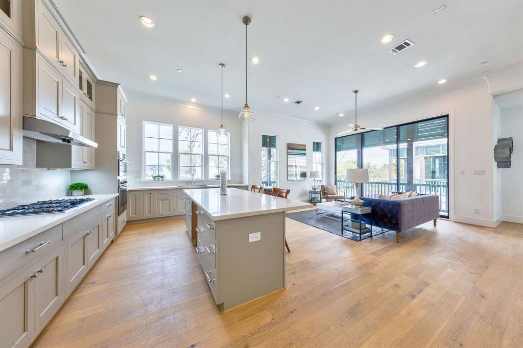 soaring 12ft ceilings and tons of natural light with large kitchen similar to this home but bigger