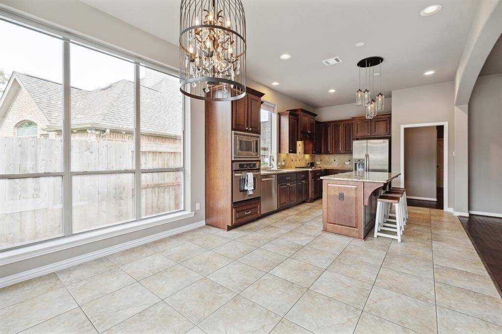 This view of the Kitchen shows access to Butler's Pantry and Dining Room.