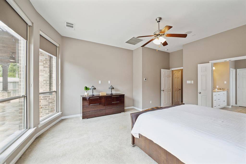 Primary Bedroom with view to ensuite bathroom.