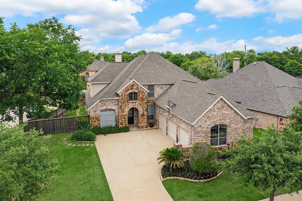 Stunning Highland Home on large corner lot in Sienna Village of Waters Lake.