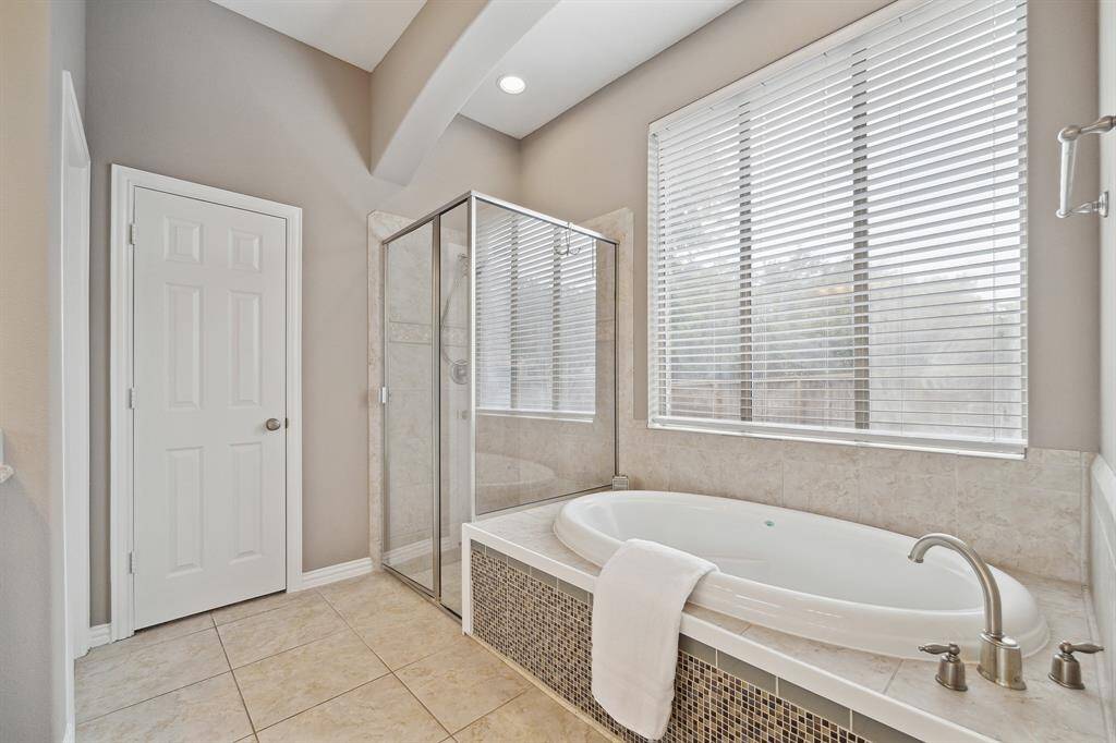 Large walk-in closet through the door in this view of the Primary Bathroom.
