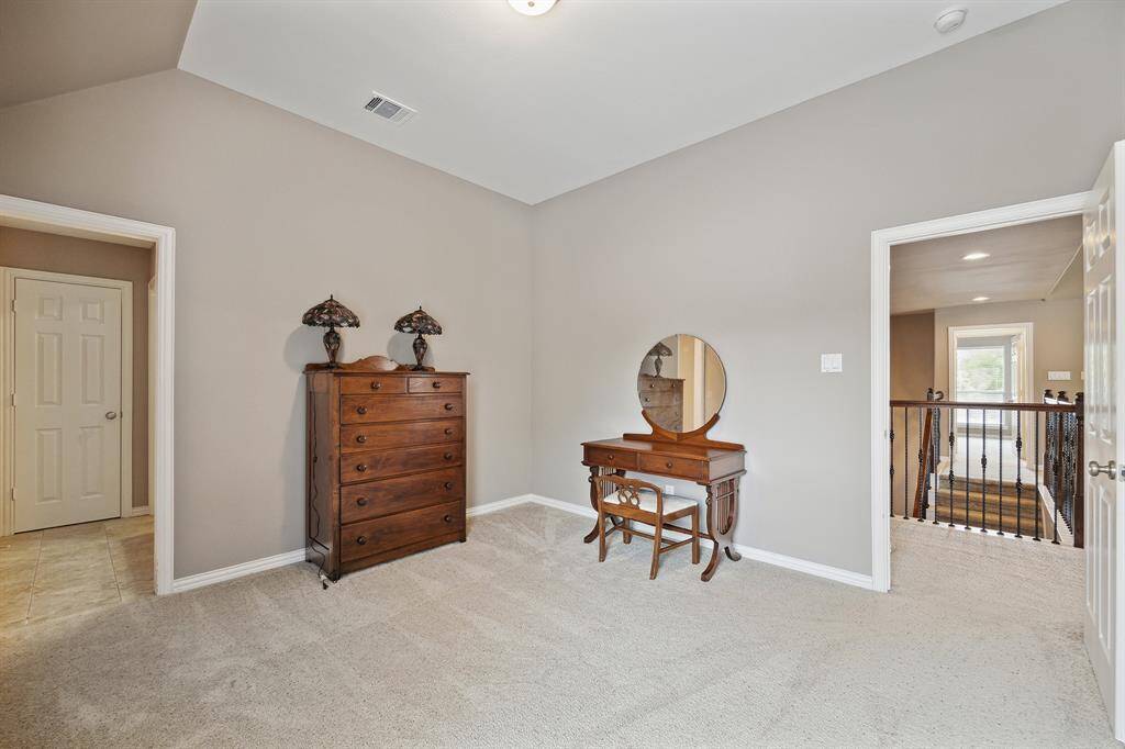 One of three secondary bedrooms on the second floor.