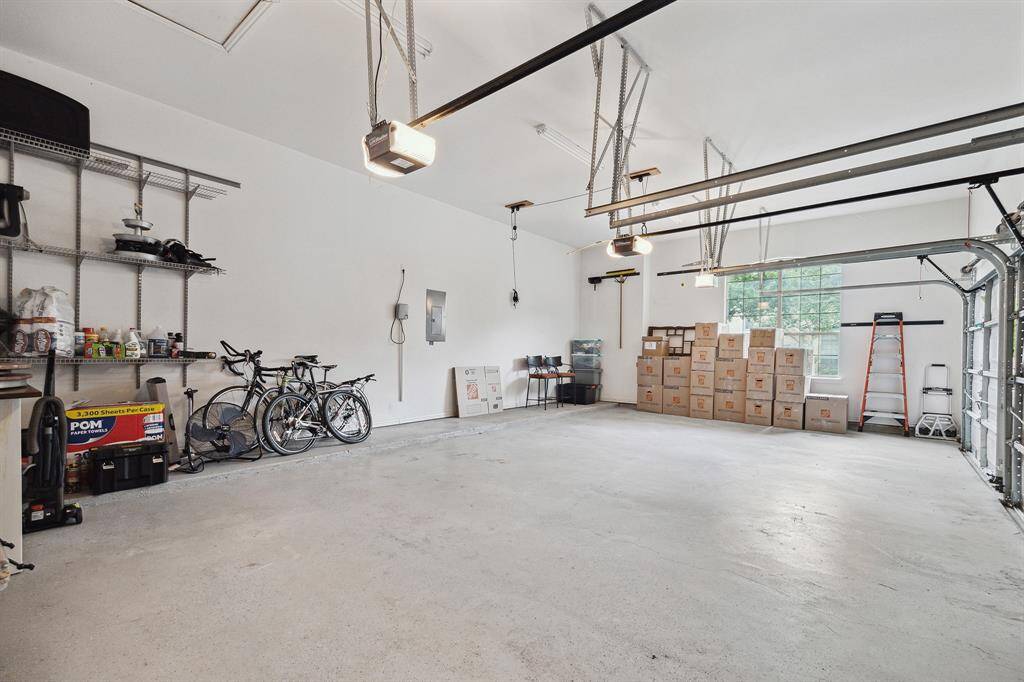 This huge garage boasts three side by side bays and epoxy flooring.