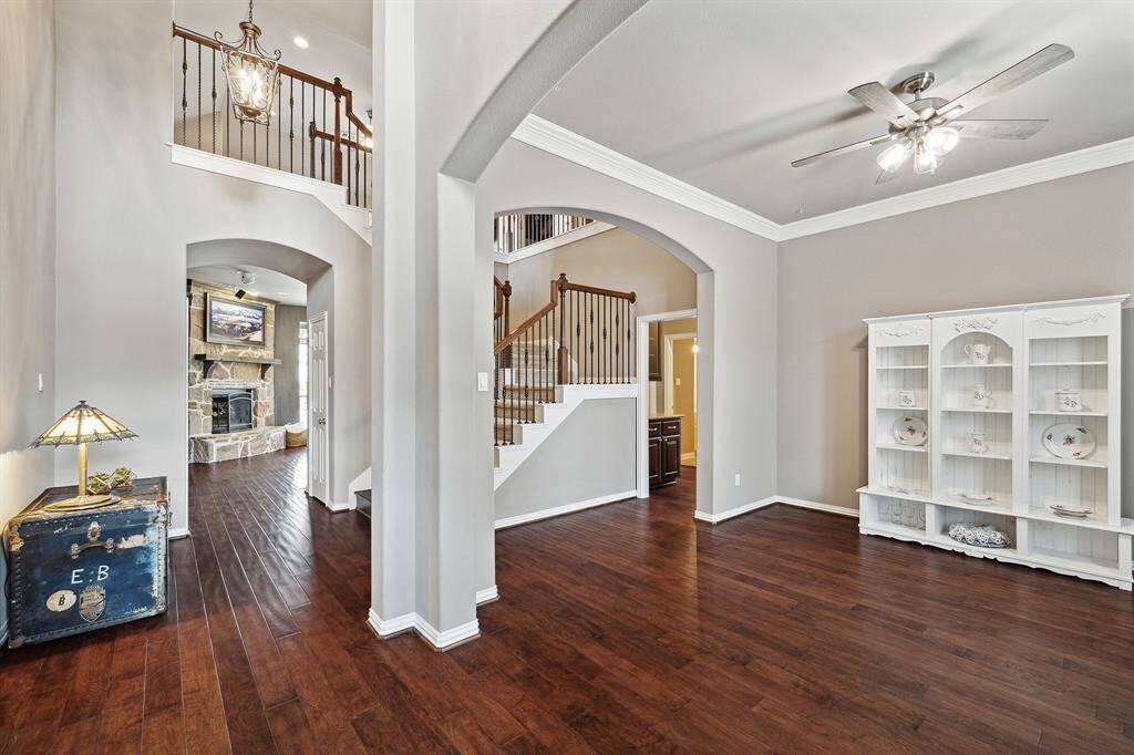 Enter the foyer with a view to the Formal Dining Room on the right, Den straight ahead.  Gorgeous wood flooring throughout this space and the Den.