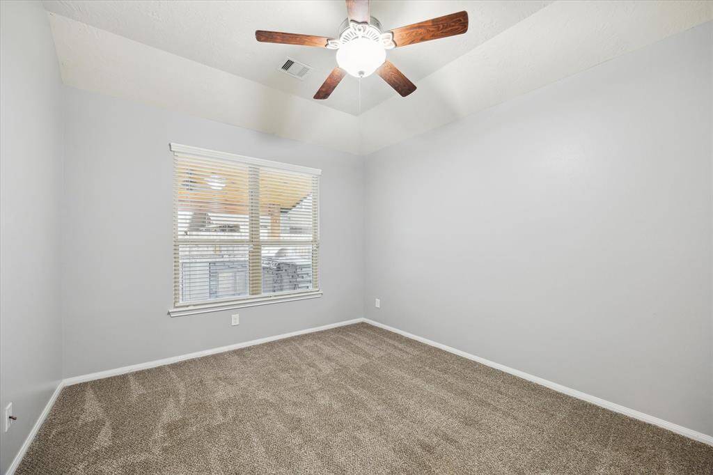 Primary bedroom overlooking the covered patio area.