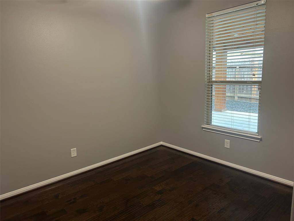 Third bedroom with hardwood floors.  Please note walls as same color as rest of home.