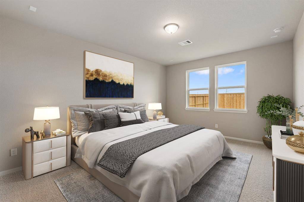 The primary bedroom is generously sized, creating a tranquil and spacious retreat that offers ample room for relaxation. Featuring plush carpet, high ceilings, fresh paint, and large windows that lets in natural lighting throughout the day.