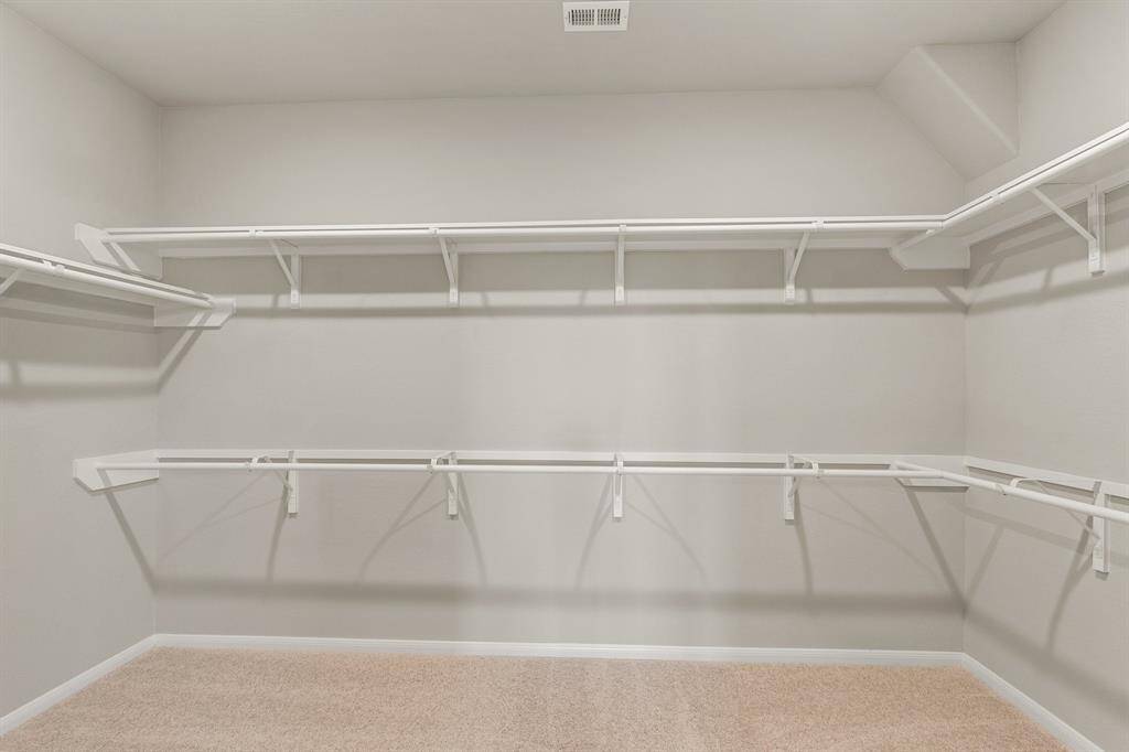 A view of your large primary walk-in Closet