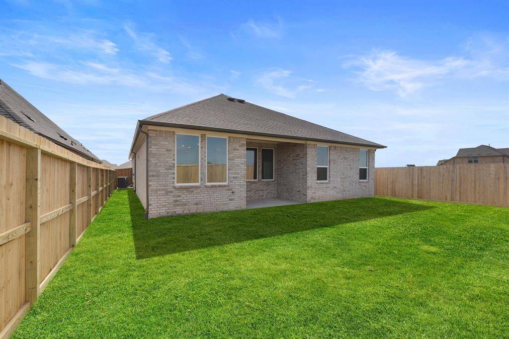 This backyard is perfect for family gatherings, social events, or simply unwinding in the fresh air.