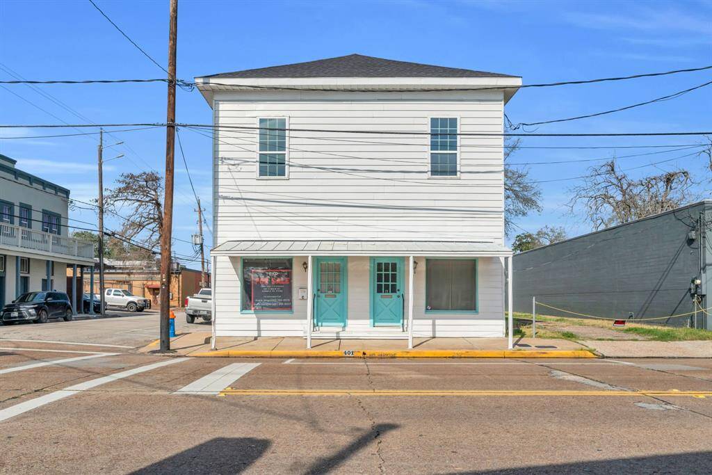 Front of building facing Main Street. Note two front entrances with large picture windows on each side.