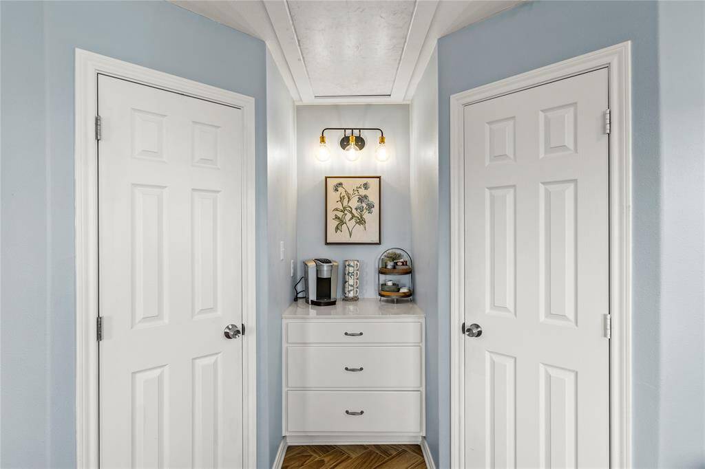 Primary bedroom with walk in closets and private coffee bar.