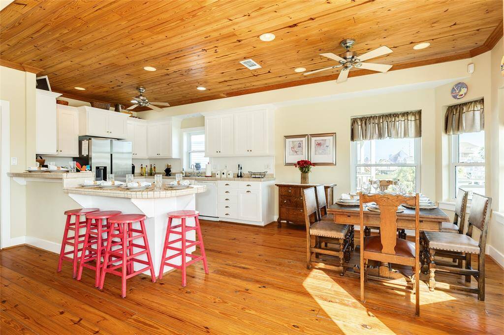 This dining and breakfast and counter bar can seat 14 comfortable.  Dining area currently seating 6 but has room for larger table for extra seating.  Beautiful wood ceiling for cozy surrondings.