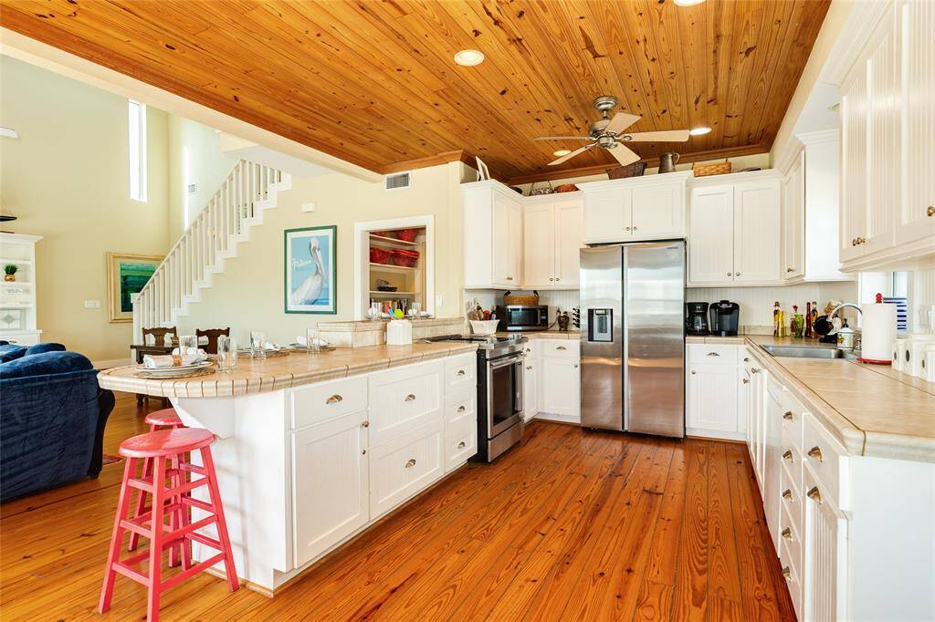 Tons of cabinets and counter space. Stainless appliances with Jennair stove.