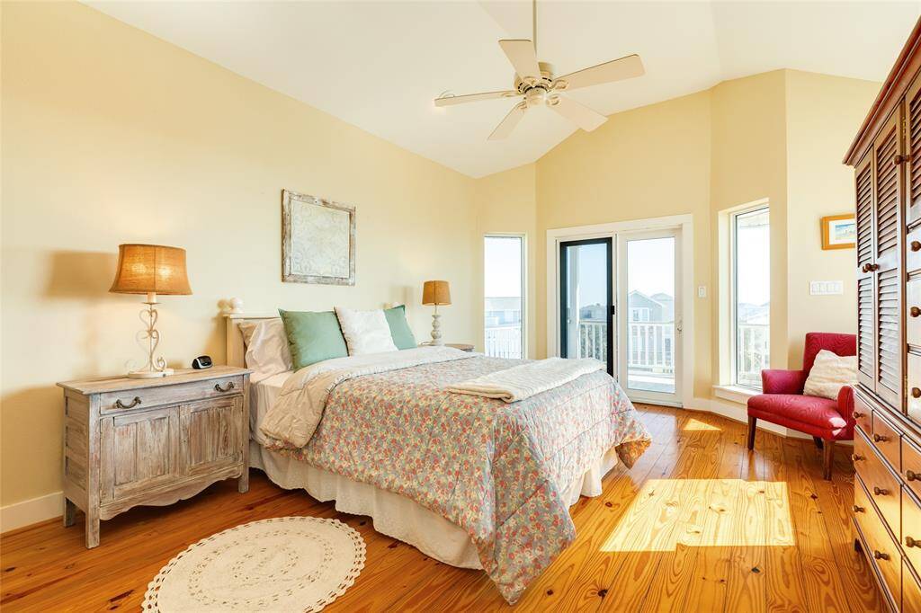 Spacious primary bedroom located upstairs with deck for enjoying morning coffee, reading and evening sunsets.