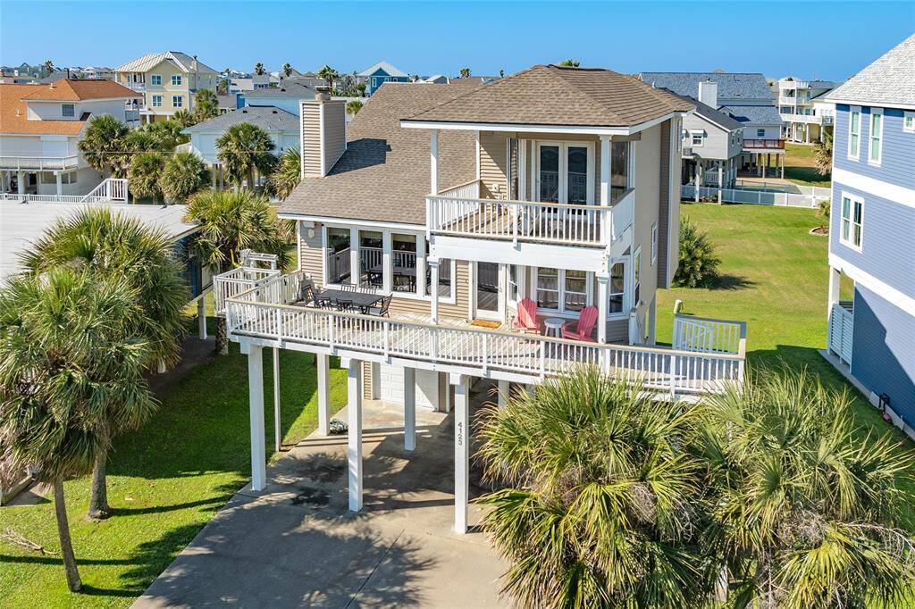Side view of home with beautiful surrounding homes.