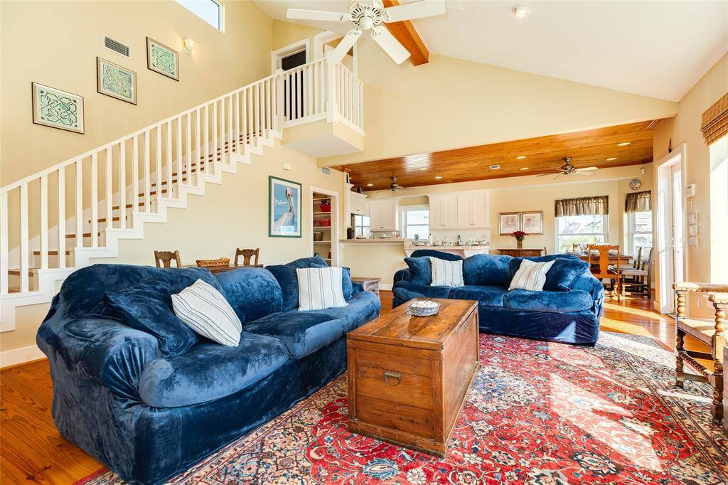 Upper stairs leading to primary bedroom and extra bonus room used for bedroom that would make great office.