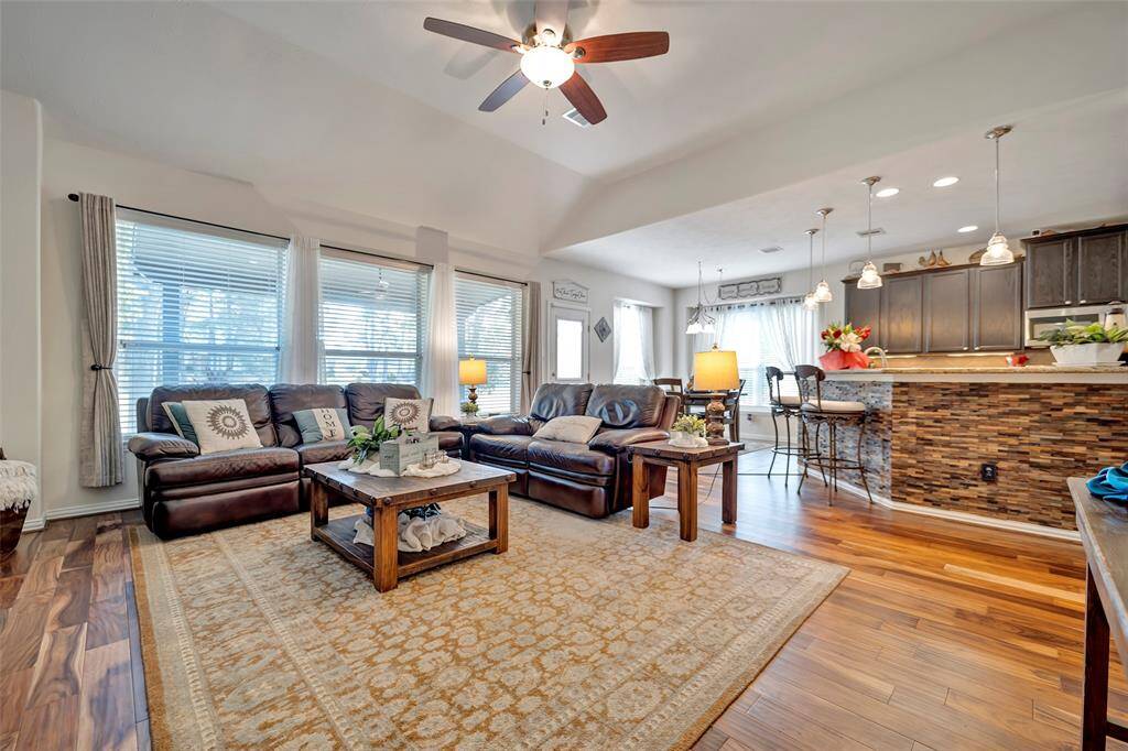Open to the kitchen and backyard