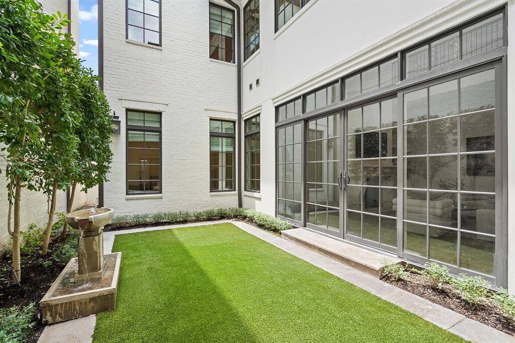 Private courtyard professionally landscaped and low maintenance turf.