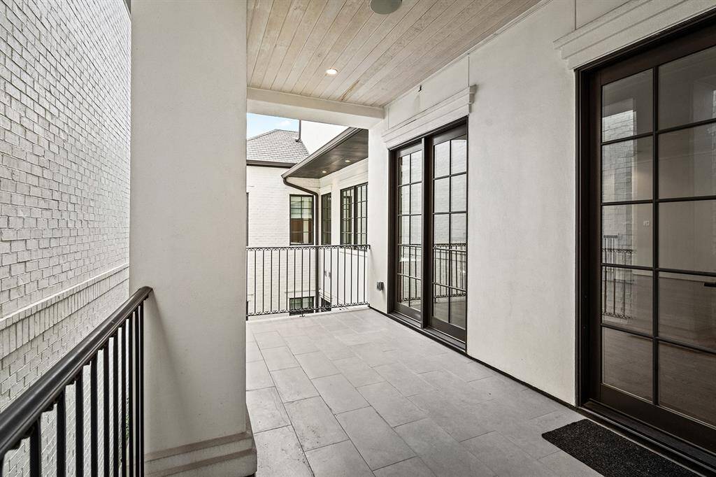 Spacious covered balcony located off the game room.