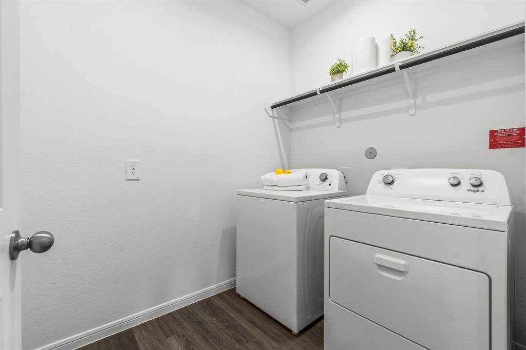 This is a dedicated laundry room. Washer and dryer INCLUDED with ample shelving space above the appliances.