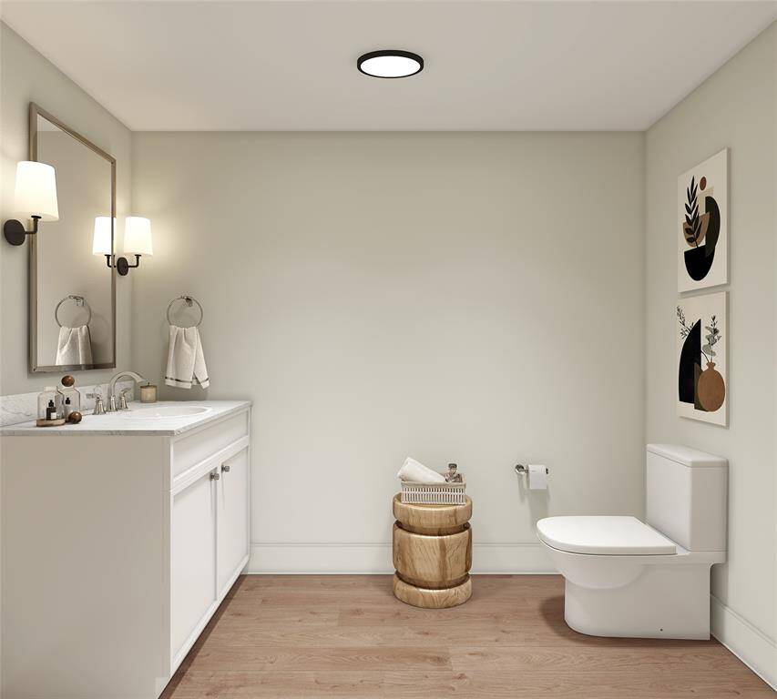 Tucked Away – The powder room is designed to ensure privacy while being conveniently accessible. Painted vanity, quartz countertop, undermount porcelain sink, wall mounted faucet, framed mirror flanked by elegant light sconces on both sides.