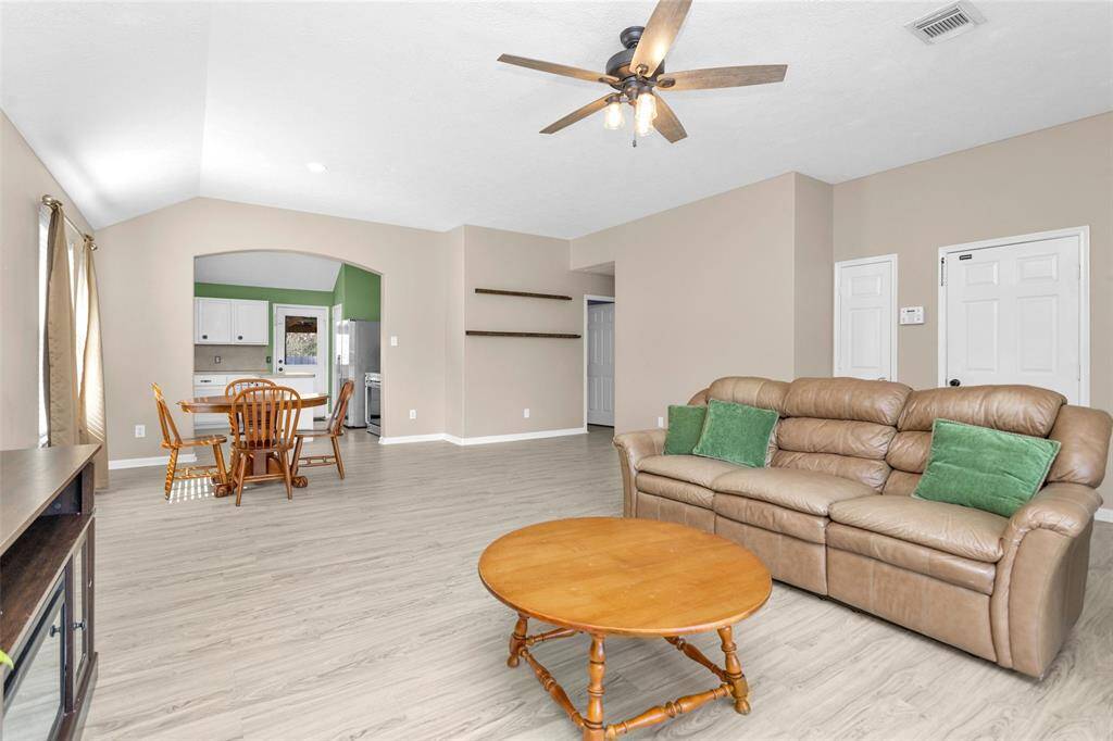kitchen lies adjacent to the living room, giving a bit of privacy while keeping that open vibe