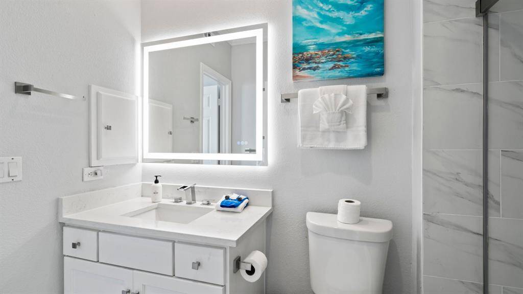 Beautifully remodeled bath features the latest in bath design.