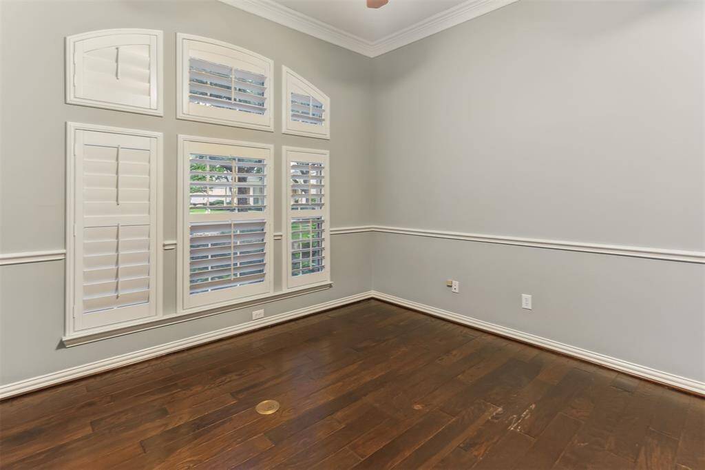 7014 Lake Haven Ct, Sugar Land Tx 77479- This recently painted office/study offers a private space for you to work from home. Plantation shutters and chair railing.