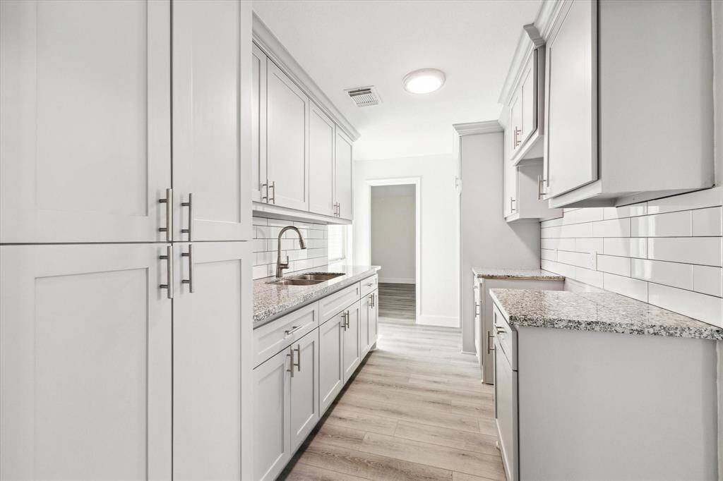 The photo shows new cabinets with plenty of storage space.