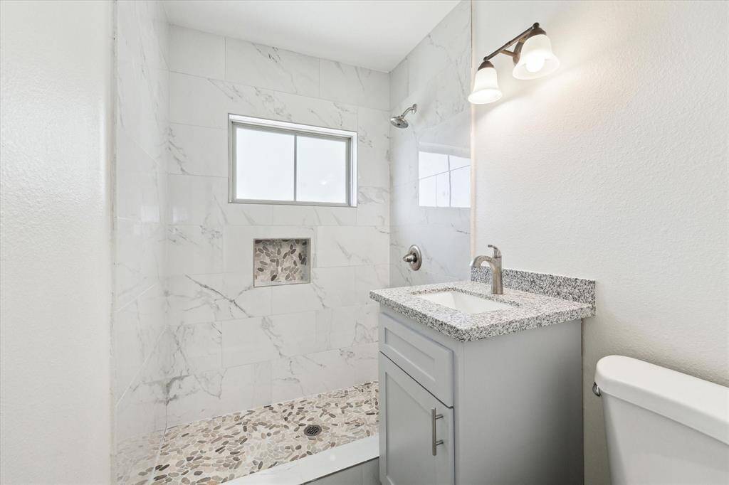 Renovated bathrooms with modern touches.