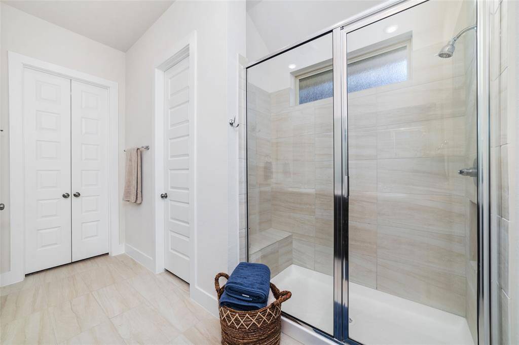 Oversized primary en suite with its oversized shower