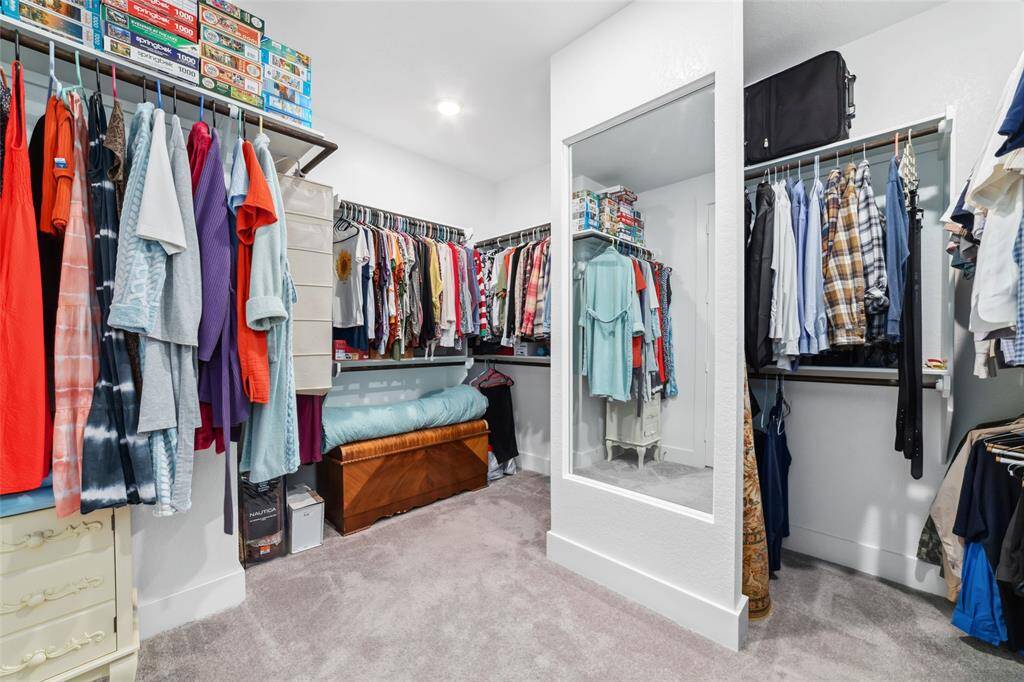 Oversized closet in your primary bedroom with a perfect divider for space and not having to share.