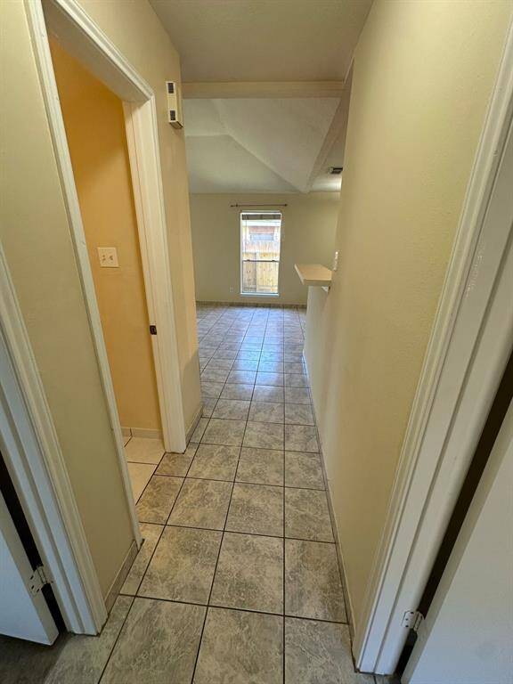 ACCES HALLWAY TO SECONDARY BEDROOMS.