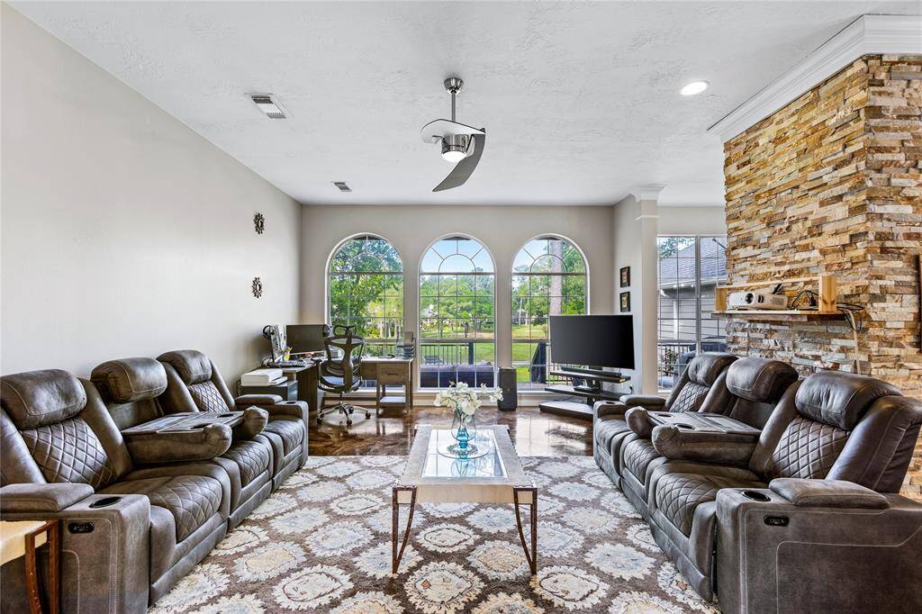 Open concept living area. Showcasing the views of the course.