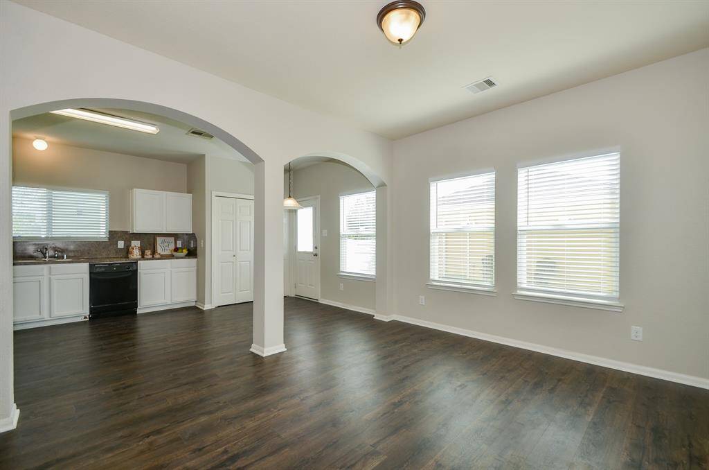 Further into this beautiful home on your right is thefamily/living room. Catch up with the paper or a goodbook on the couch next to your large windows with new blinds thatprovide soothing natural light.