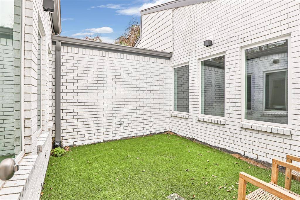The true highlight of this home is the private atrium patio, complete with high-quality turf, creating a lush, maintenance-free outdoor oasis—ideal for morning coffee, outdoor dining, or a peaceful escape.