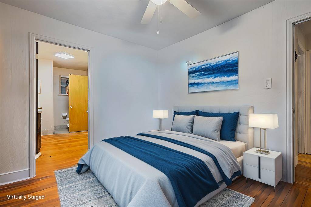 Explore Bedroom #3, featuring an en suite bath with convenient laundry room access. *Virtually staged*