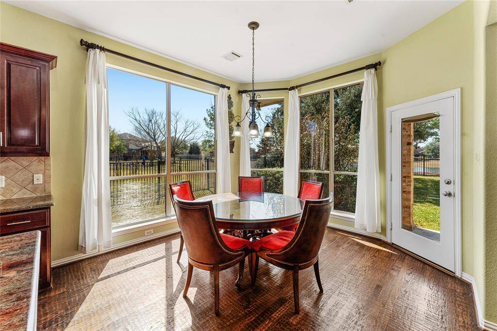 The charming breakfast area is perfectly situated with a bay window, allowing for a cozy spot to enjoy meals while taking in views of the lake views.