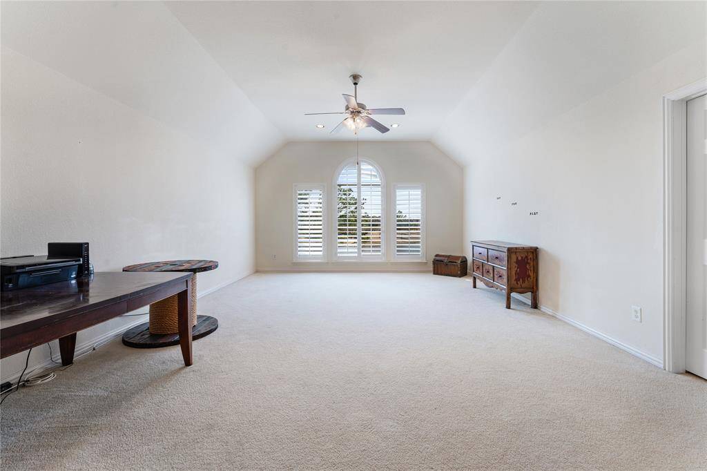 The large game room, featuring elegant shutters, offers endless possibilities for customization, whether you envision a fun play area, or a relaxed entertainment space. Its spacious layout and versatile design make it the perfect place to create whatever suits your lifestyle.