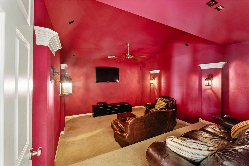 The step-down media room is designed for ultimate viewing comfort, wired for surround sound to enhance your movie and entertainment experience. With a ceiling fan for added comfort, this room offers the perfect setting for relaxing and enjoying your favorite films or shows.